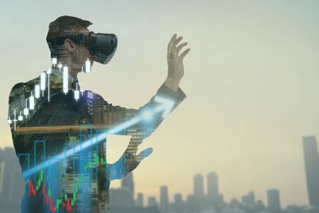 double explosure business man use augmented mixed virtual reality to show the growth graphの写真素材
