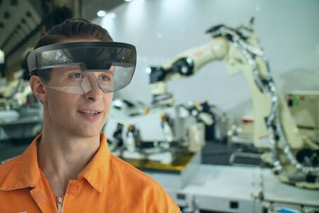 iot smart technology futuristic in industry 4.0 concept, engineer use augmented mixed virtual reality to education and training, repairs and maintenance, sales, product and site design, and more.の写真素材