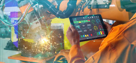 smart factory which use futuristic technology which combine big data, iot, 5g, machine deep learning, automation robot, augmented mixed virtual reality, digital twin, artificial intelligenceの写真素材