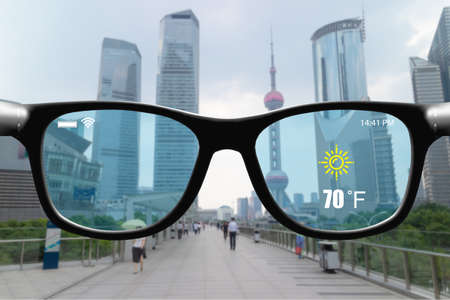 Futuristic technology trend concept in smart glasses.business man can get experience with use smart glasses which has augmented reality while work travel playの写真素材