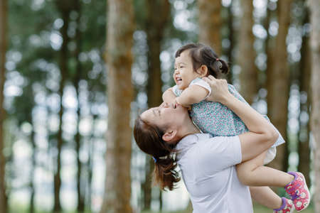 The little girl A kid with mom Funnyの写真素材