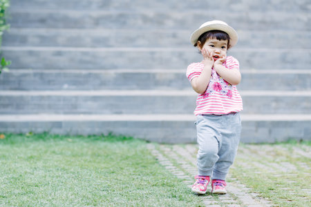 The little girl Running for fun in the garden.