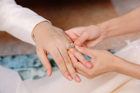Hand of lover are wearing a ring on her wedding dayの写真素材