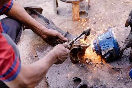 Asians Craftsman being using gas welding steel in a factory.の写真素材