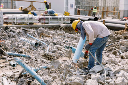 Construction worker being using gas welding steel in construction area.の写真素材