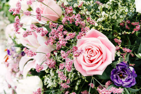 Pink roses arranged in a bouquet of flowers.の写真素材