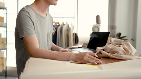 Young LGBTQ Asian Men and women Small Business Partner, Hands on the keyboard that is pressing...