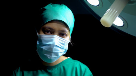 doctor looked at the patient with a sad look on his face, and face looks sad about what happened after surgery but the patient died, doctor lowered his head in regret.の写真素材