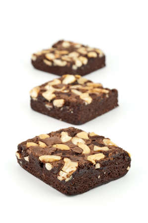cashew nut brownie isolated on white backgroundの写真素材