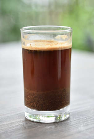 a cup of arabica coffee ready to be enjoyed with a blur backgroundの写真素材