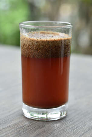 a cup of arabica coffee ready to be enjoyed with a blur backgroundの写真素材