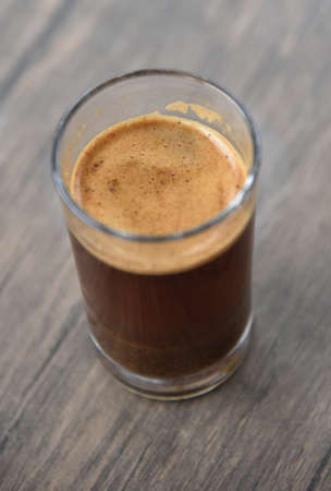 a cup of arabica coffee ready to be enjoyed with a blur backgroundの写真素材