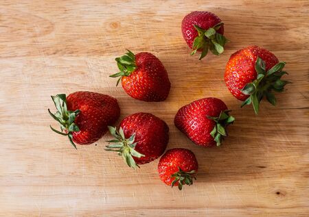 Strawberries on a wooden background.の写真素材