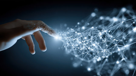 A human hand interacts with a luminous digital network comprised of interconnected points and lines. The image showcases cool blues and bright white lights against a dark background, suggesting a futuristic concept. Suitable for illustrating ideas related to technology, communication, or the digital world. Useful for web design and editorial projects.の素材