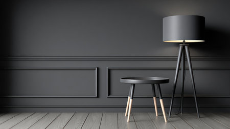 This image showcases a modern interior design. A black lamp and a small table stand against a dark gray wall, creating a stark contrast. The composition highlights geometric shapes and textures. The lighting is focused, suggesting a studio setting, suitable for illustrating concepts of design and decor.の素材