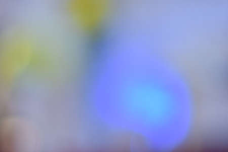 Colorful bokeh with neon lights at night time, motion movement with traffic light in the city on car windshield view, blurred light background. Speed fast with driving car. Long exposure.の写真素材