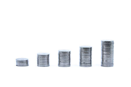 pile of silver coins stack and growing money graph on rows, isolated on white background with clip path. Income, profits, finance, Investment, Interest and Saving money concept, indonesia rupiah.の写真素材