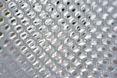 A simple white texture pattern of hexagons as a background