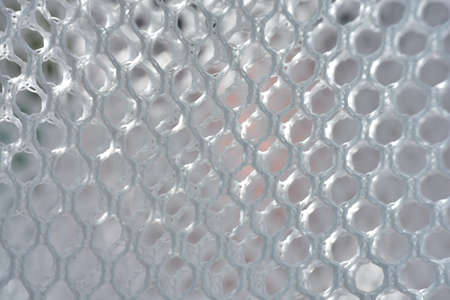 A simple white texture pattern of hexagons as a background