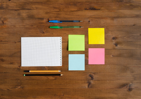 Set of office supplies on old wooden table