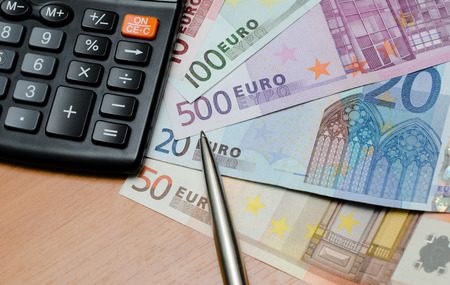 Euro money background and calculator close upの写真素材