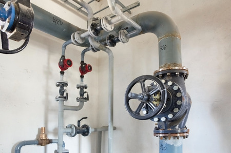 Place in a large industrial boiler room. Parts replaced during repair workの写真素材