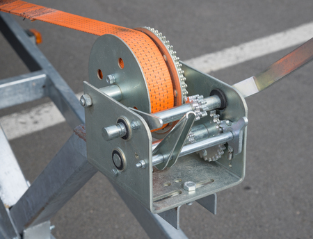 Boat trailer winch with orange rope.の写真素材