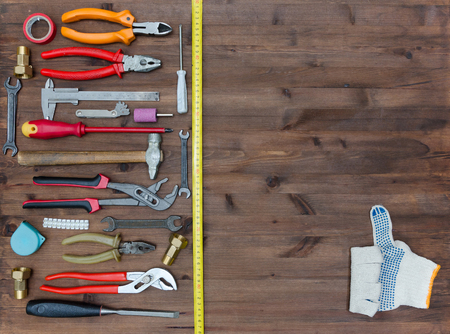 Set of tools on old wooden table.の写真素材