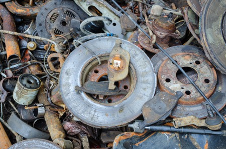 Useless, worn out rusty brake discs shock absorber and other partsの写真素材