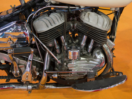 Closeup of a motorcycle engine and attachments