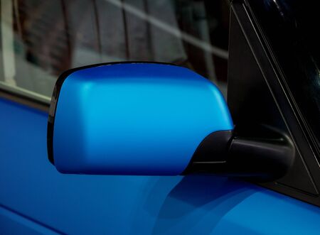 Rear view mirror of new blue carの写真素材