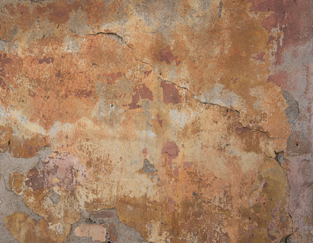 Old concrete wall with cracks and chipped