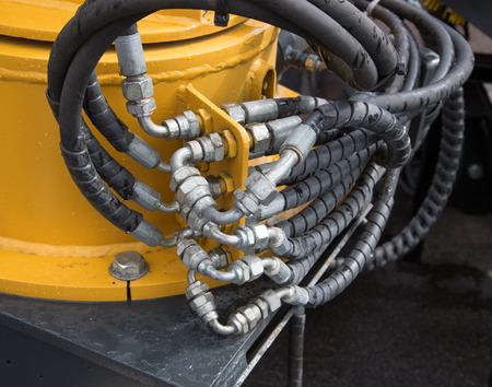 Hydraulic tubes, fittings and levers of lifting mechanism