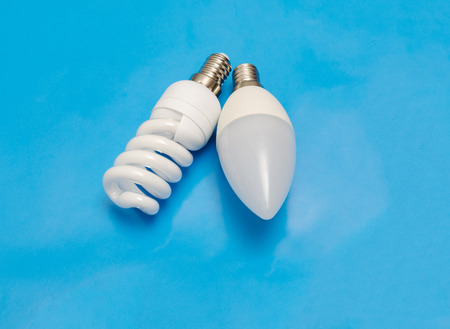 Energy saving and modern light emitting diode lamps on blue background.