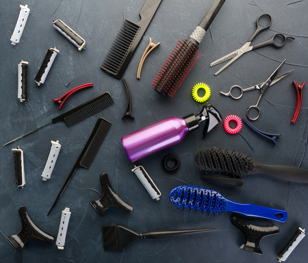 Top view of professional hair dresser tools on black concrete backgroundの写真素材