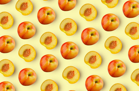 seamless texture. Whole and halves nectarines on light yellow background. Excellent retouching...