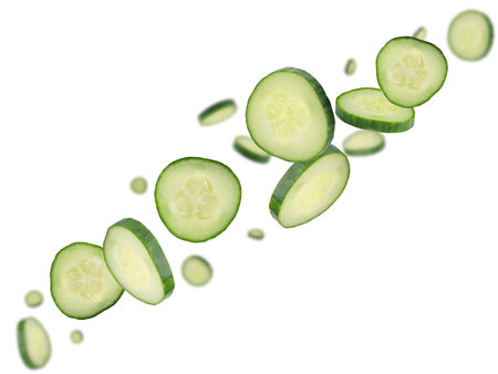 Sliced cucumbers fly in space forming a chain shape. Isolated on whiteの写真素材