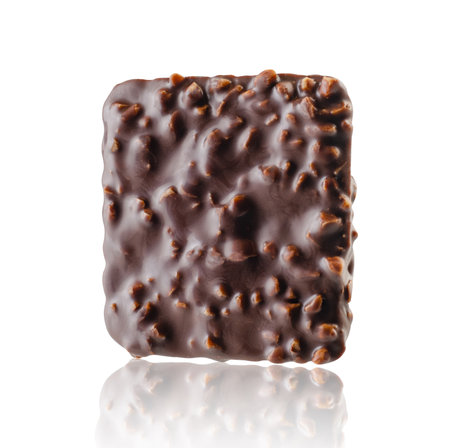Chocolate cookies glazed with nuts isolated on whiteの写真素材