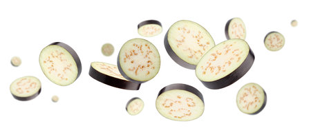 Sliced pieces of eggplant fly and levitate in space. Isolated on whiteの写真素材