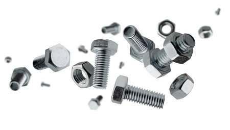 Set of bolts and nuts flies and levitates in space. Isolated on whiteの写真素材