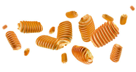 Home made pies spiral surface fly and levitate in space. Volumetric back light. Isolated on white.の写真素材