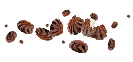 Chocolate covered corrugated marshmallow flies and levitates in space. Isolated on whiteの写真素材