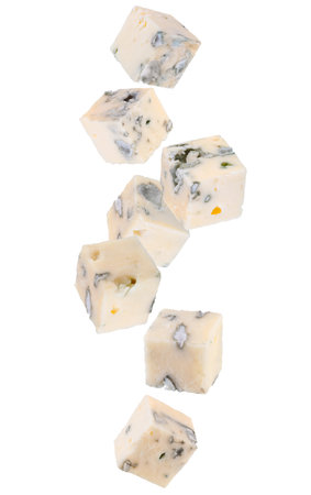 Blue cheese cubes falling in space. Isolated on white