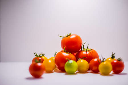 Colorful tomatoes with white backgroundの写真素材