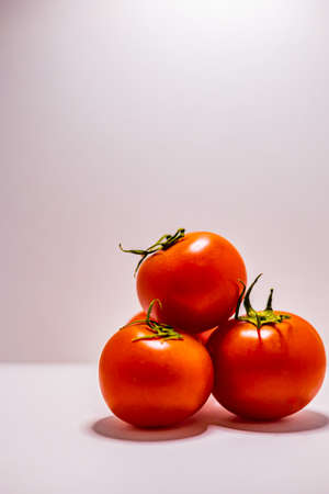 Colorful tomatoes with white backgroundの写真素材