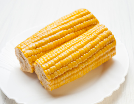 two cobs of boiled corn on the plate