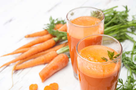 fresh carrot juice from young carrotsの写真素材