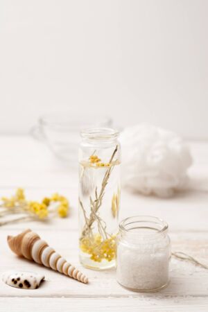 sea salt, herbs for cooking recipes at home on a white wooden background