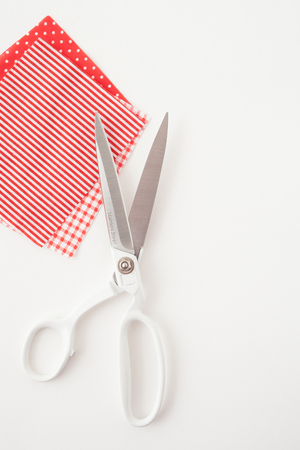 Tools for patchwork, sewing from pieces of cloth, hand-made articles. Place for the text.の写真素材