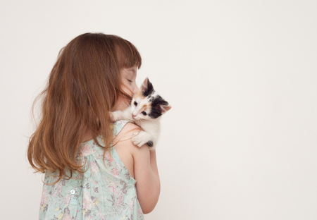 The child takes care of his pet. Place for the text.の写真素材